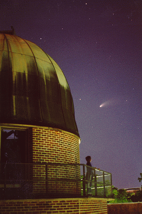 observatory dome at Gallalee Hall, against a night sky; Comet Hale-Bopp is visible